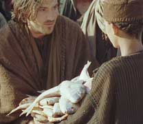 Jesus receiving leftover fish