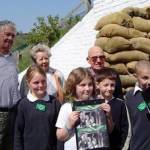 Pupils and ex-pupils from Whitehawk School outside restored 'Trenches'