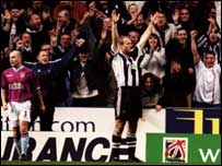 Shearer celebrates against Aston Villa