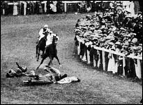 Emily Davison throws herself in front of the horse of King George V during a suffragette protest