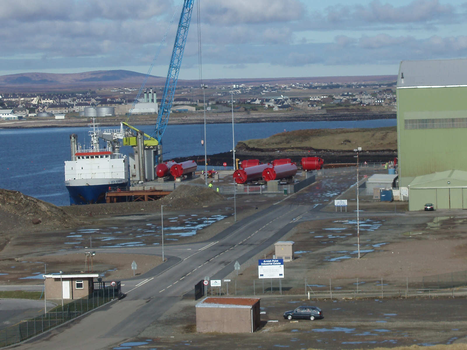 The wave generator parts ready for loading at Glumag Harbour, Arnish