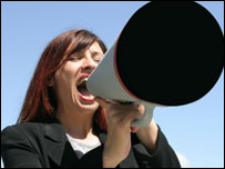 Woman shouting into megaphone