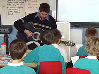 BBC Suffolk reporter Jon Wright and Risby Primary School pupils sing Pick it up