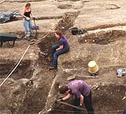 A group of archaeologists at the excavation site