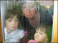 Helen and children look out at the rain!
