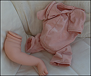 Parts of a reborning kit - leg and unfilled body 