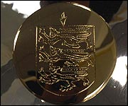 The gold Guernsey crest