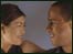Man and woman facing each other and smiling.