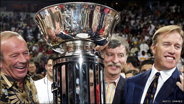 Colorado Crush owners Pat Bowlen, Stan Kroenke and John Elway celebrate victory in Arena Bowl XIX
