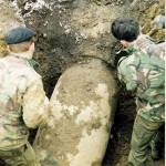 Troops excavate bomb and establish size and type, but this type was not recorded in any of the books on bombs dropped in the UK