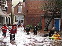Canoes alongside cyclists knee-deep in water, Worcestershire (sent in by Carol Tisdale)