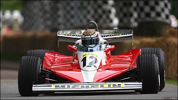 Former Ferrari driver Eddie Irvine drives Gilles Villeneuve's 1978 Ferrari 312 T3 at Goodwood