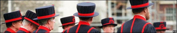 Yeomen Warders of the Tower of London wait to begin the swearing-in ceremony for three new recruits on Tower Green, in front of the White Tower, Tuesday, March 31, 1998
