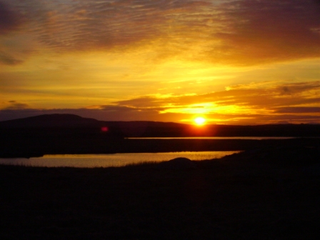 sunrise over benbecula from the west shore road.