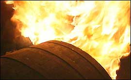 Burning tar barrel