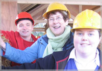 Dominic Bonner (left) from Derry’s Children’s Commission, joins Carmel Mulrine and Francine Moran from Ballymagroarty Hazelbank Community Partnership to build the walls on the interior structure of Derry’s new environmentally friendly Eco Base building, which will be used as a launch-pad for ‘green’ projects.