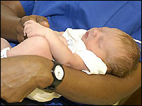 midwife and new born baby