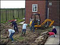 Volunteers from Furness Building Society in the garden with Diane and Veronica from the Special Needs Department