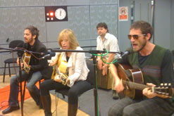 Carly Simon performing in the Woman's Hour studio with her band, including her son, Ben Taylor (right)
