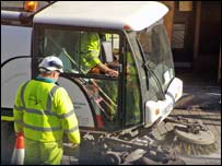 Street cleaning machine in operation