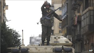 Soldier standing on tank in Cairo