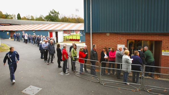 Supporters queue for tickets to see the game against Manchester United.