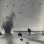 Dover Harbour 1940. An attacking aircraft can be seen in the top right.