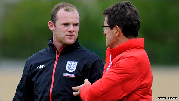 Wayne Rooney chats to Fabio Capello