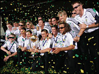 The Australian cricket team pose with the World Cup