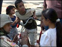 Three children with an army officer