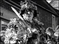 Mummer with costume and sword