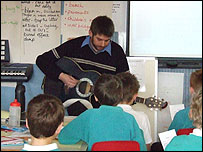 Jon Wright shows school children his Pick It Up song