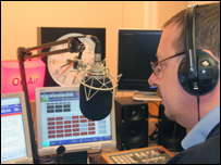 Andrew Hewkin reading the news