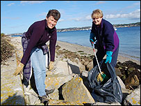 Elizabeth Woodford and Janet Thomas doing a litter pick on one of the beaches