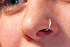 Close-up of a girl with a pierced nose