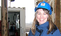 Gabrielle Walker stands in front of a drill