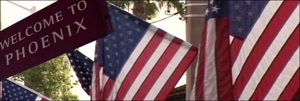 US flags and Welcome to Phoenix sign
