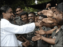 MP Weerawansa greeting security force personnel