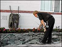Paul looks at the finished wall