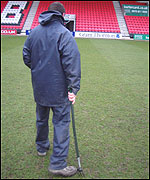 Andrew puts the divots in the pitch