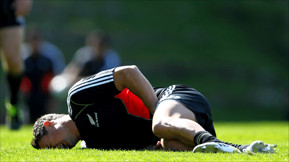 Dan Carter lies on the floor after being injured while practicing his kicking