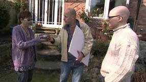 Joe Swift showing the couple from Birmingham how to measure up their garden