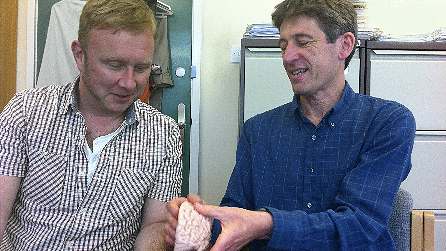 Adam Walton and Prof. John Aggleton with a model of the brain