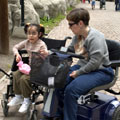 A disabled mother and daughter, both wheelchair users