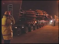 Angel on a low loader