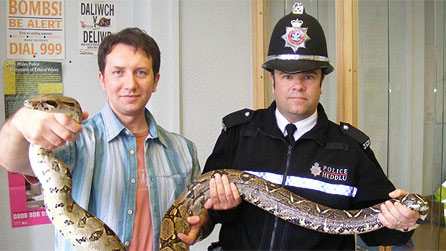 Rhys and local police with an escaped boa constrictor