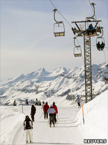 Skiers on chairlift
