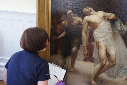 Inspecting a painting by Williams