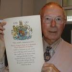 Albert Ramsden with the scroll sent to the family after his father died three weeks before VE Day