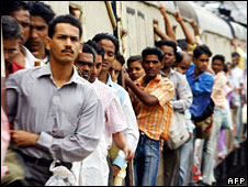 Commuters on a suburban train in Mumbai